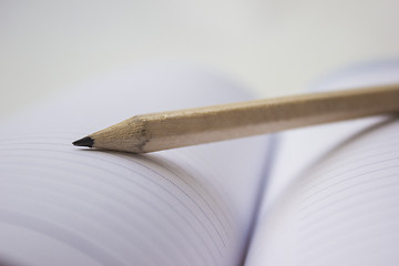 Image showing Pencil on a book