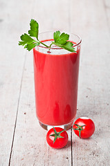 Image showing tomato juice in glass and fresh tomatoes 