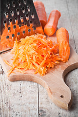 Image showing metal grater and carrot 