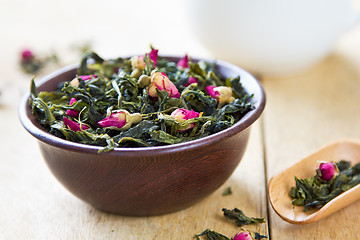 Image showing Green tea leaves with rose buds