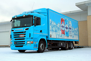 Image showing Turquoise Scania R500 Delivering Goods to a Store