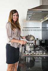 Image showing Business woman cooking