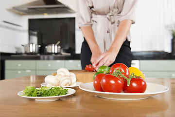 Image showing Cutting fresh ingredients