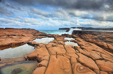 Image showing Waves splash on magnificent rock formations