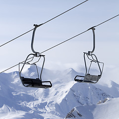Image showing Ropeway at ski resort and mountains in fog