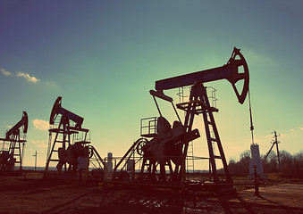 Image showing oil pumps silhouette - vintage retro style