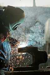 Image showing Welder working in factory