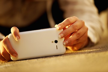 Image showing Woman taking photos with her phone