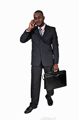 Image showing Black man with cell phone.