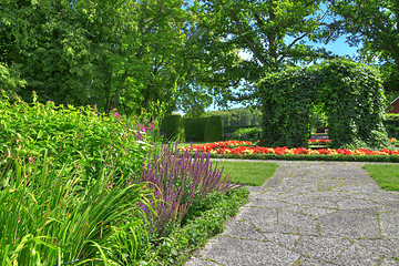 Image showing Ornamental garden with stone paths