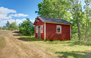 Image showing Traditional Swedish cabin painted in red color