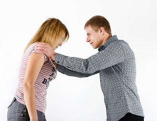 Image showing young woman fighting with a man