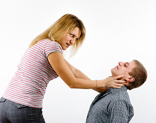Image showing young woman fighting with a man