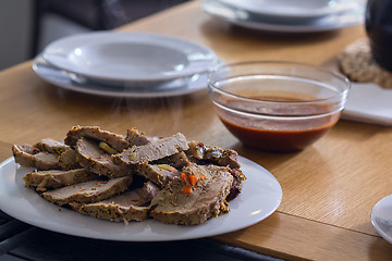 Image showing Roasted meat slices on the table