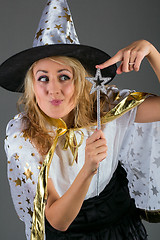 Image showing Fairy with magic wand at grey background
