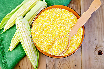 Image showing Corn grits with corn cobs on a board