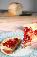 Image showing eating bread and jam