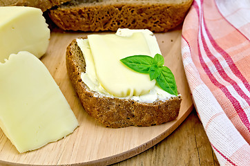 Image showing Sandwich with cheese suluguni and butter on board