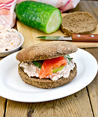 Image showing Sandwich with cream and salmon with cucumber on board