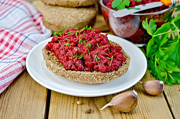 Image showing Sandwich with beet caviar on board