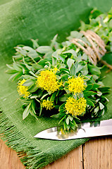 Image showing Rhodiola rosea with a knife on the board