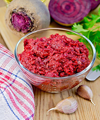 Image showing Beet caviar in a glass bowl on a blackboard