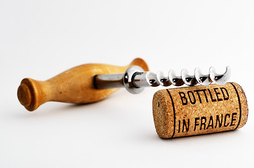 Image showing vintage corkscrew and wine cork with inscription bottled in Fran