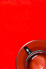 Image showing empty cup on a red background