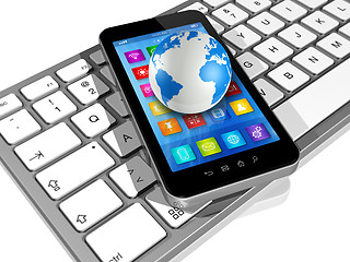 Image showing Smartphone on Computer Keyboard and World Globe