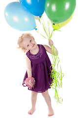 Image showing Little cute girl in dress with air balloons