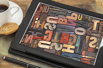 Image showing typography concept on digital tablet