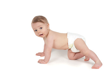 Image showing Side view of little crawling baby