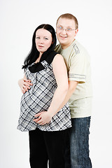 Image showing happy parents. Husband and pregnant wife
