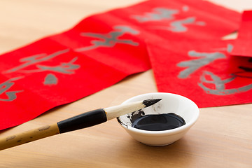 Image showing Writing the couplet for chinese new year