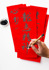 Image showing Writing of the chinese new year calligraphy, phrase meaning is b