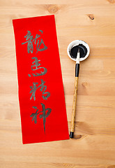 Image showing Writing of Chinese new year calligraphy, phrase meaning is bless