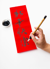 Image showing Writing of the chinese new year calligraphy, phrase meaning is b