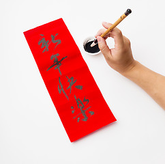 Image showing Writing of the chinese new year calligraphy, phrase meaning is h