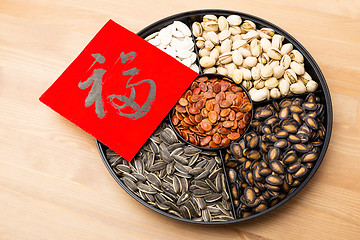 Image showing Assorted chinese sytle snack tray and chinese calligraphy, meani