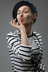 Image showing young woman shows that taste is delicious