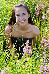 Image showing Beautiful brunette woman in grass