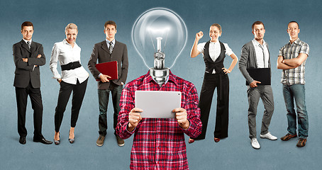 Image showing Business Team With Lamp Head