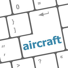 Image showing aircraft on computer keyboard key enter button