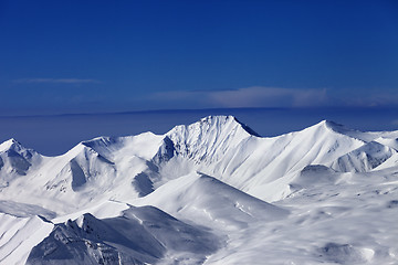 Image showing View on off-piste snowy slope at nice sunny day