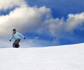 Image showing Snowboarder on ski slope at nice day