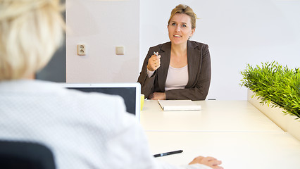 Image showing Chatting coworkers