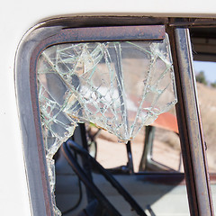 Image showing Old dirty car with busted window