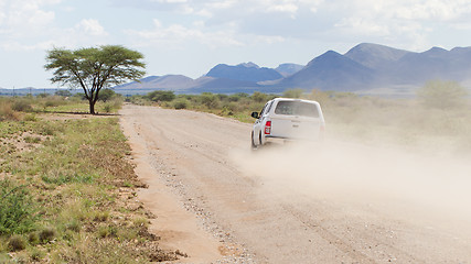 Image showing Car driving a gravel road in Namibia