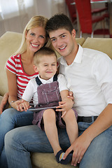 Image showing family at home using tablet computer