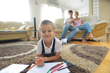 Image showing family drawing on school board at home